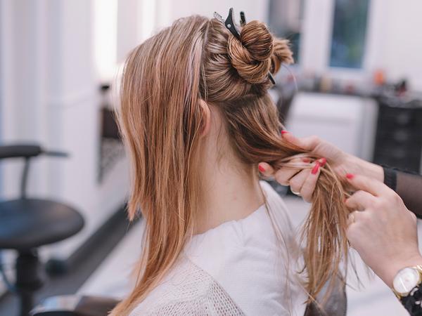 An image of a woman getting a new hair style at Carnaby Street Hairdressers.